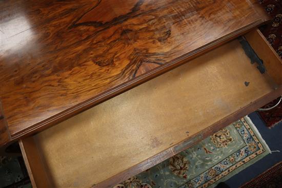 An Art Deco figured walnut desk W.109cm